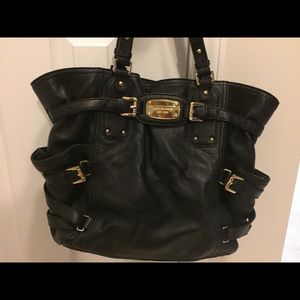 Large black leather purse with gold detailing
